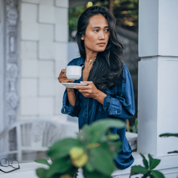 woman enjoying a cup of moodwell infused teas