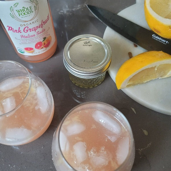 recipe using our botanical terpene infused agave.  Grapefruit wedges squeezed, pink grapefruit soda and 2 glasses with ice